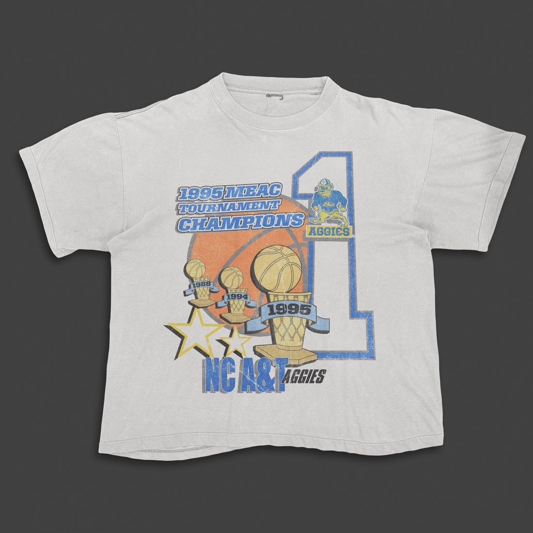 White tee with an Aggies basketball graphic