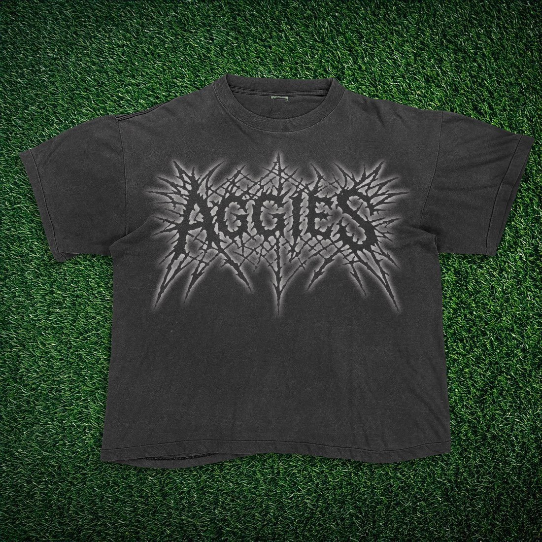 White tee with an Aggies Rock graphic