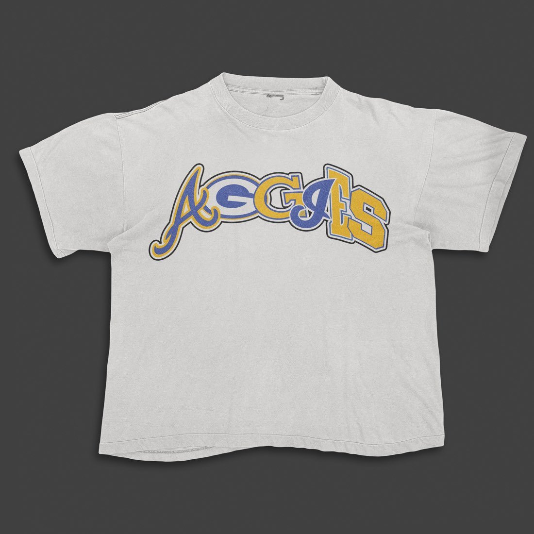 White tee with a script and block letter Aggies graphic